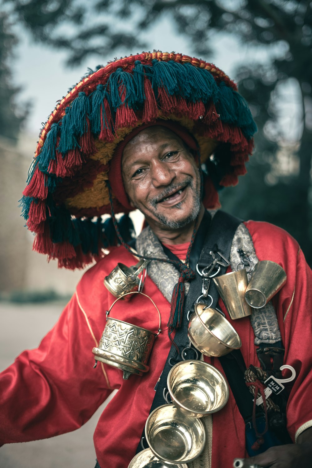 a man wearing a sombrero and bells on his head