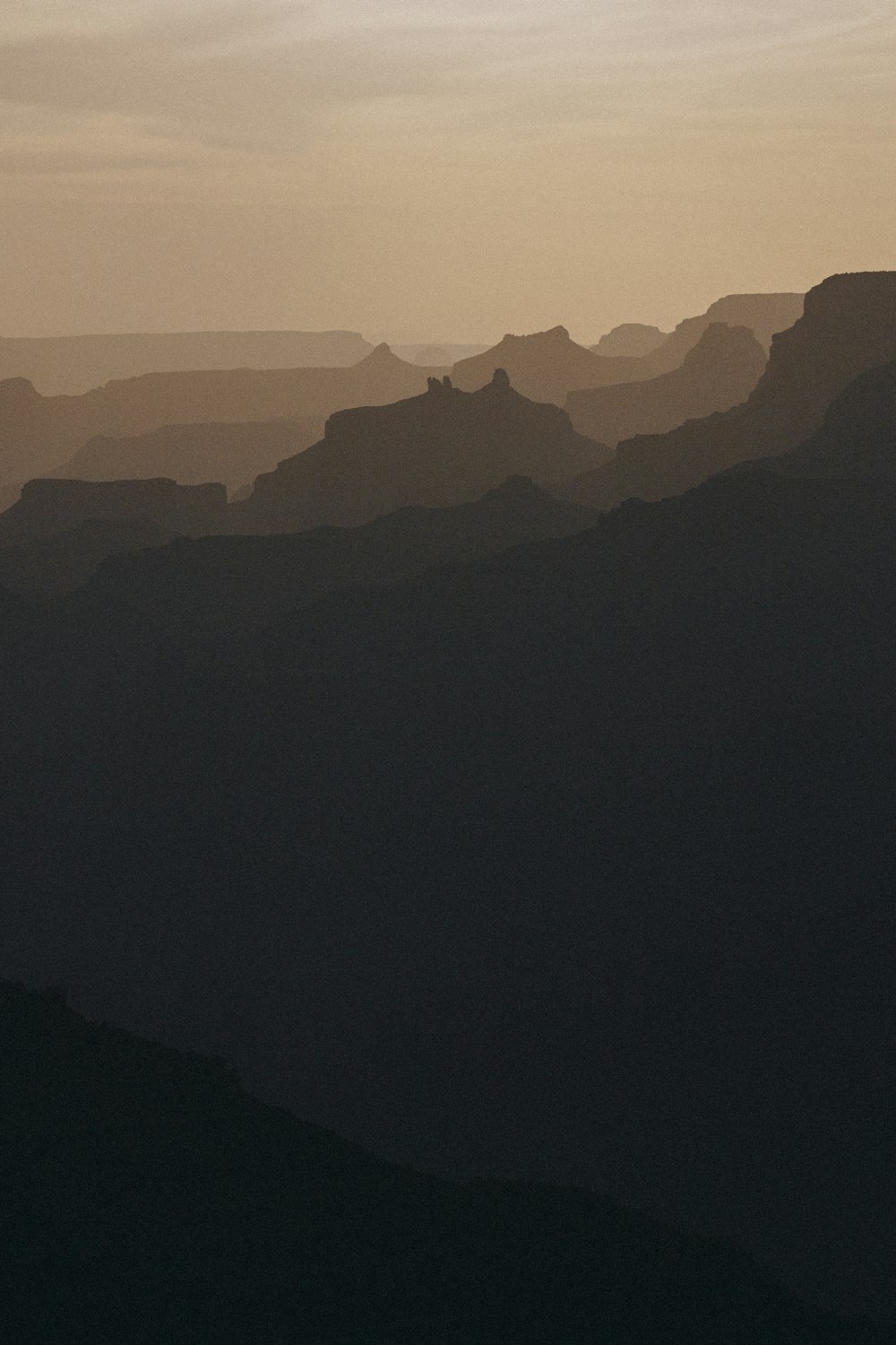 a black and white photo of a mountain range