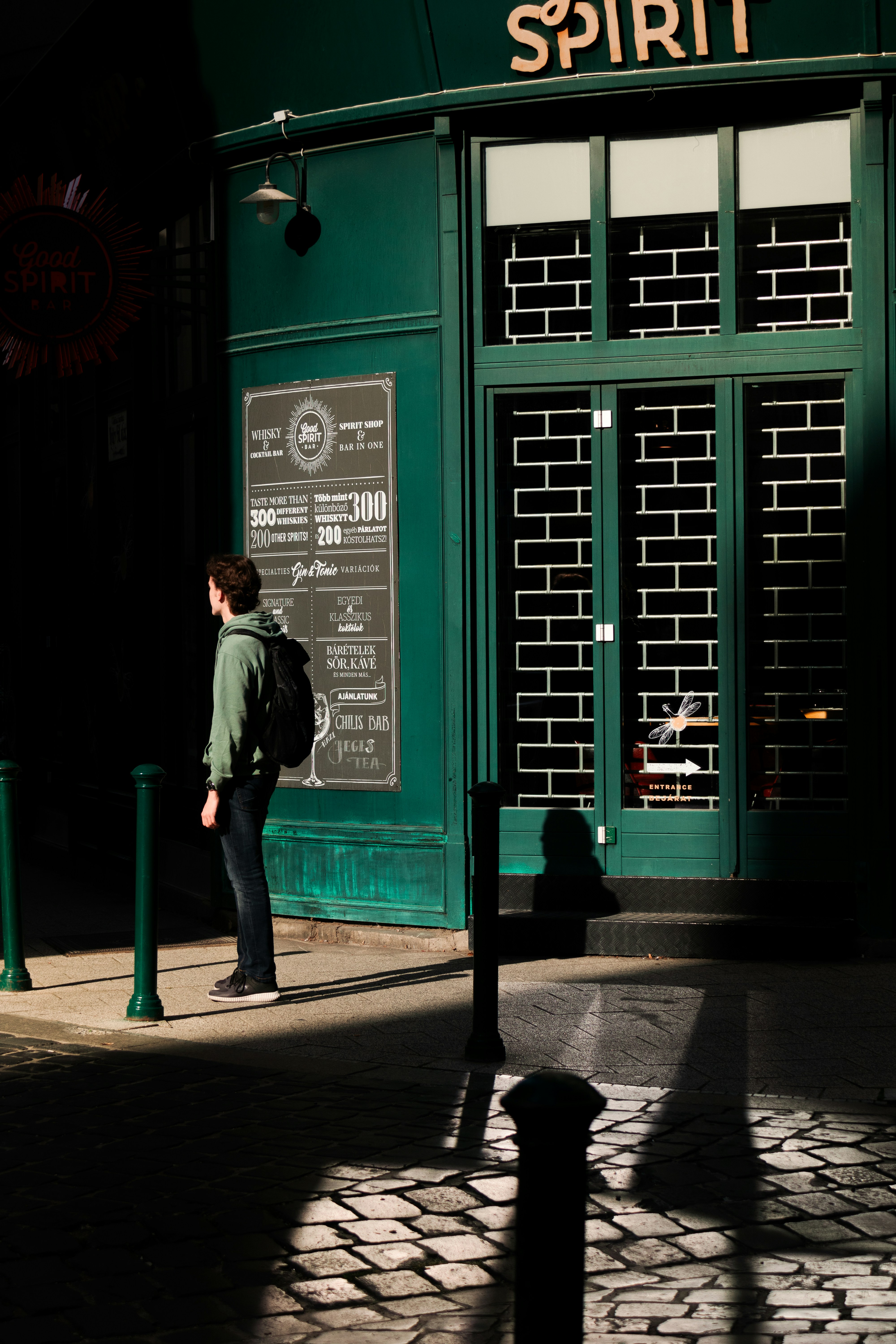 a person standing in front of a store