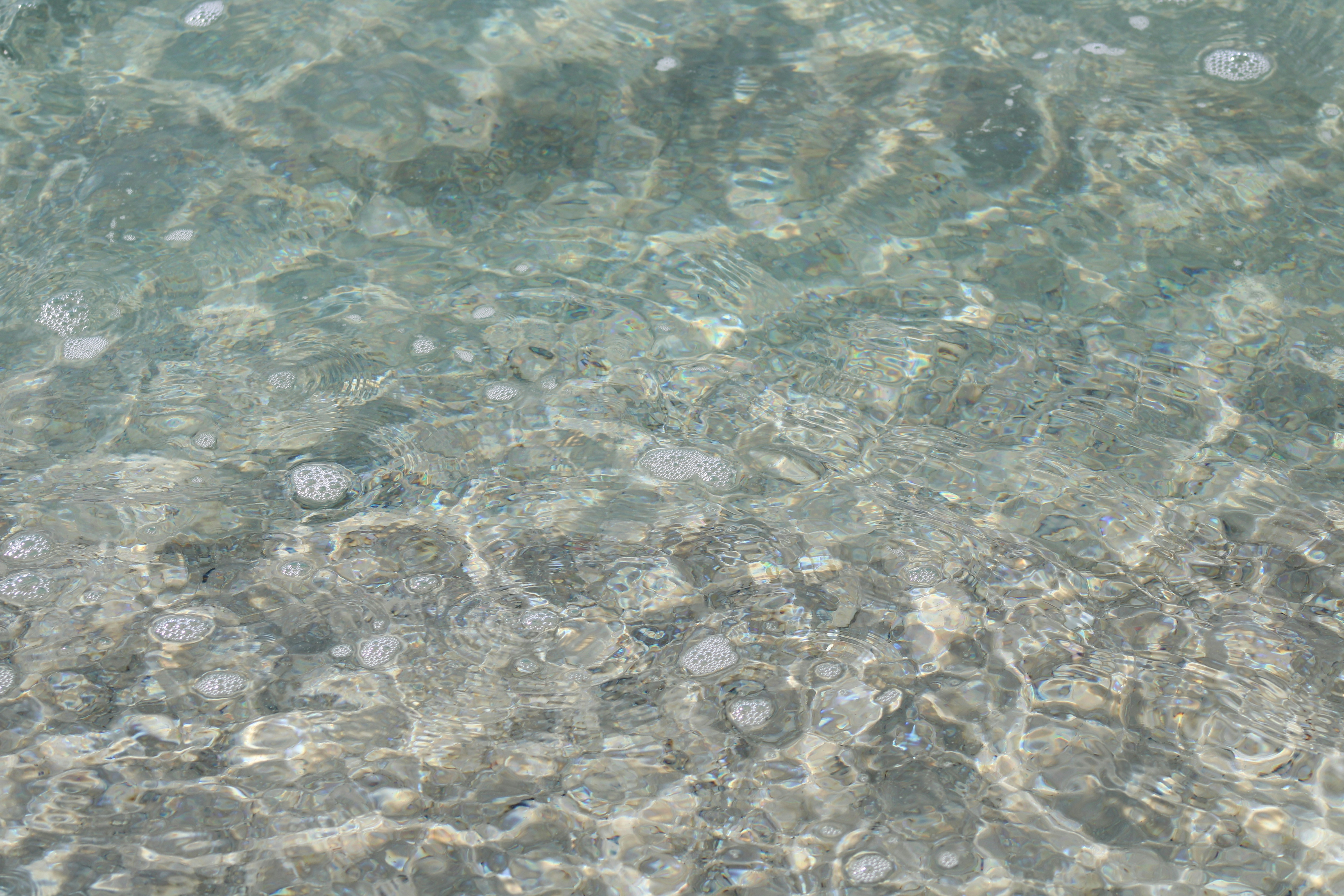 a close up of water with bubbles in it