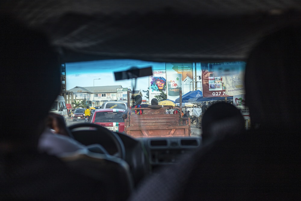 a view of a street from inside a vehicle