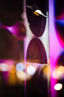 Display of premium sunglasses with a blurred city background in soft focus