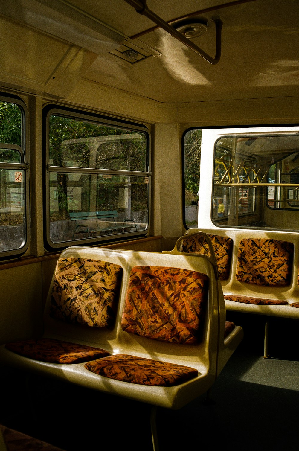 a train car filled with lots of seats next to a window