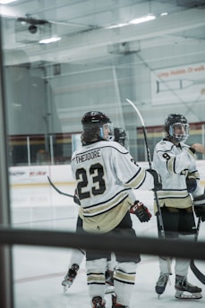 Black Hills Hockey Players Association members wearing sweatshirts at the rink
