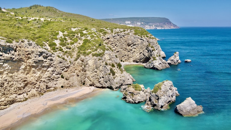 A scenic coastal view of Cassis with turquoise waters and cliffs.