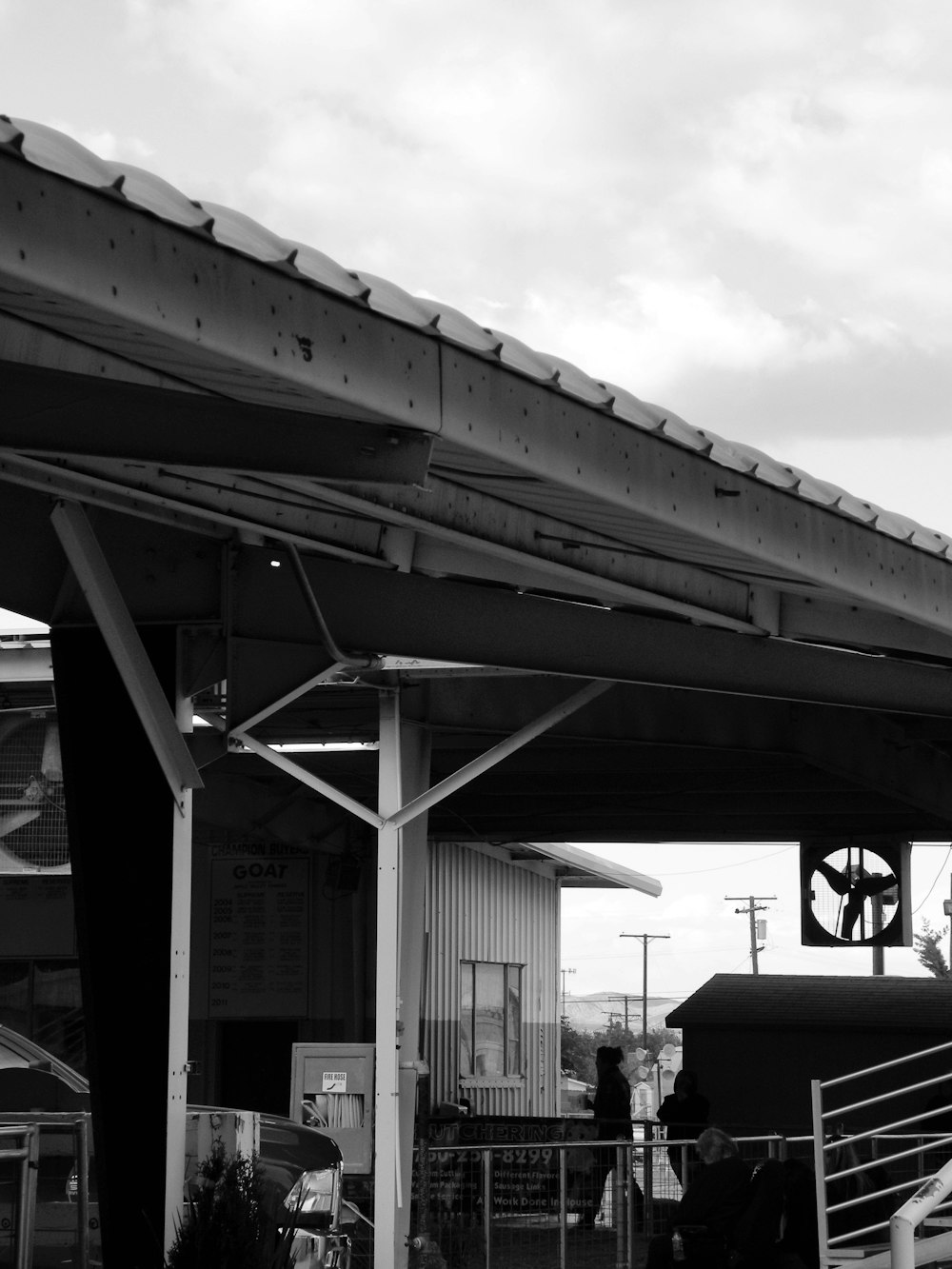 a black and white photo of a train station