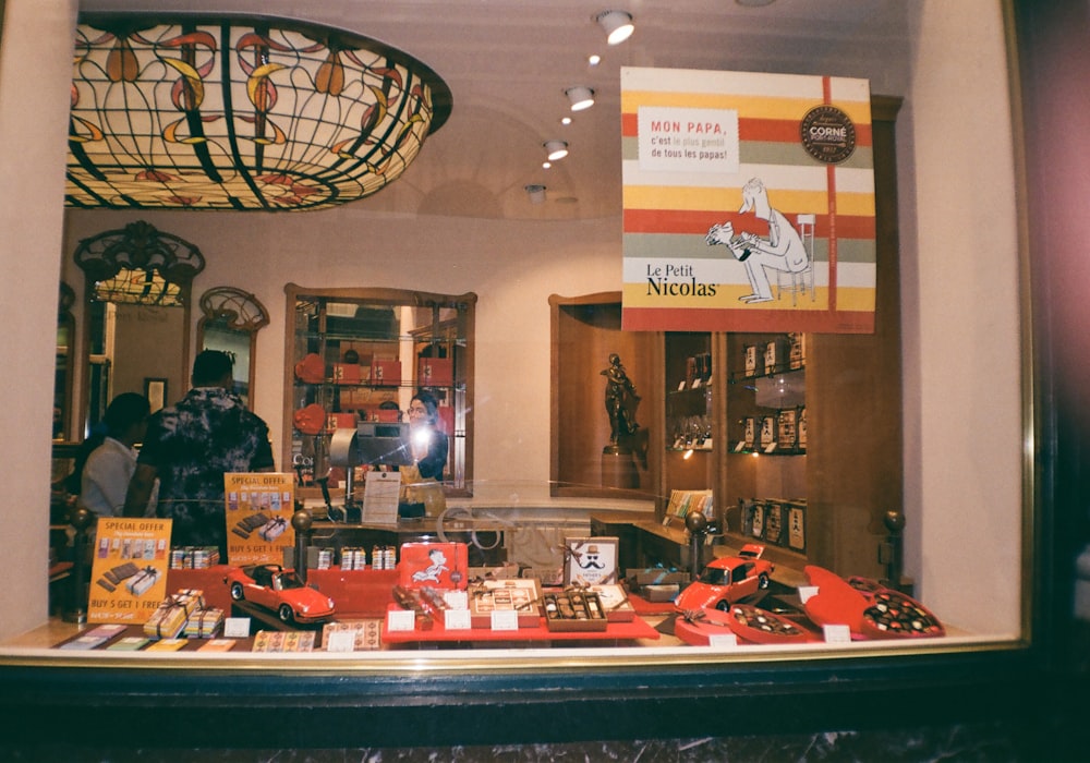 a store window with a lot of items on display