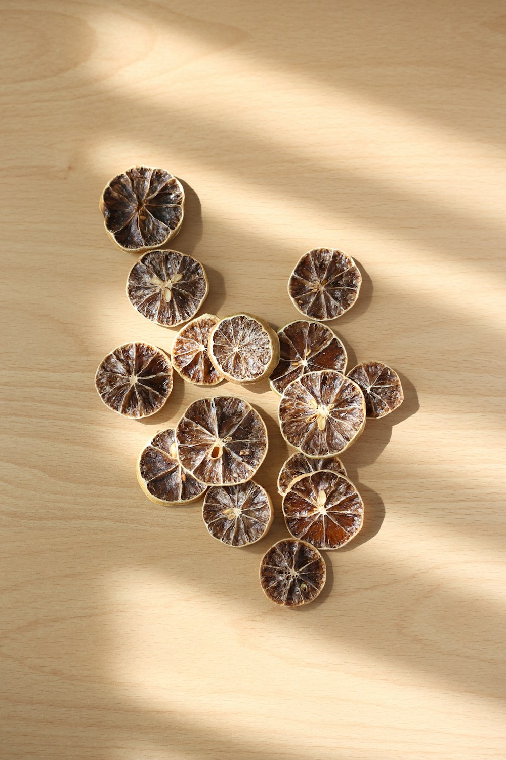 a group of oranges sitting on top of a wooden table