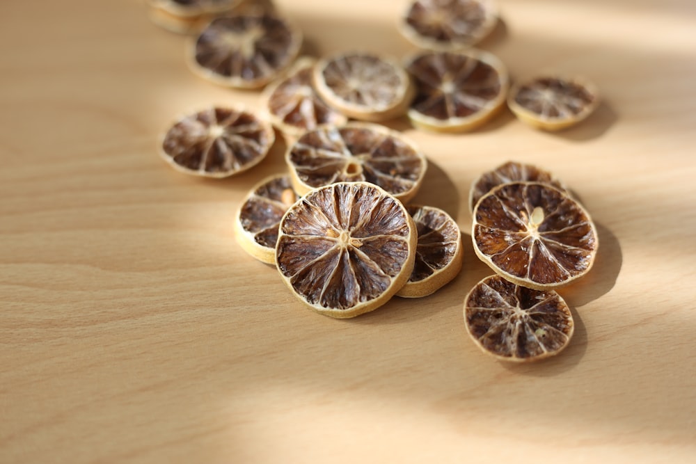 a group of sliced oranges sitting on top of a wooden table