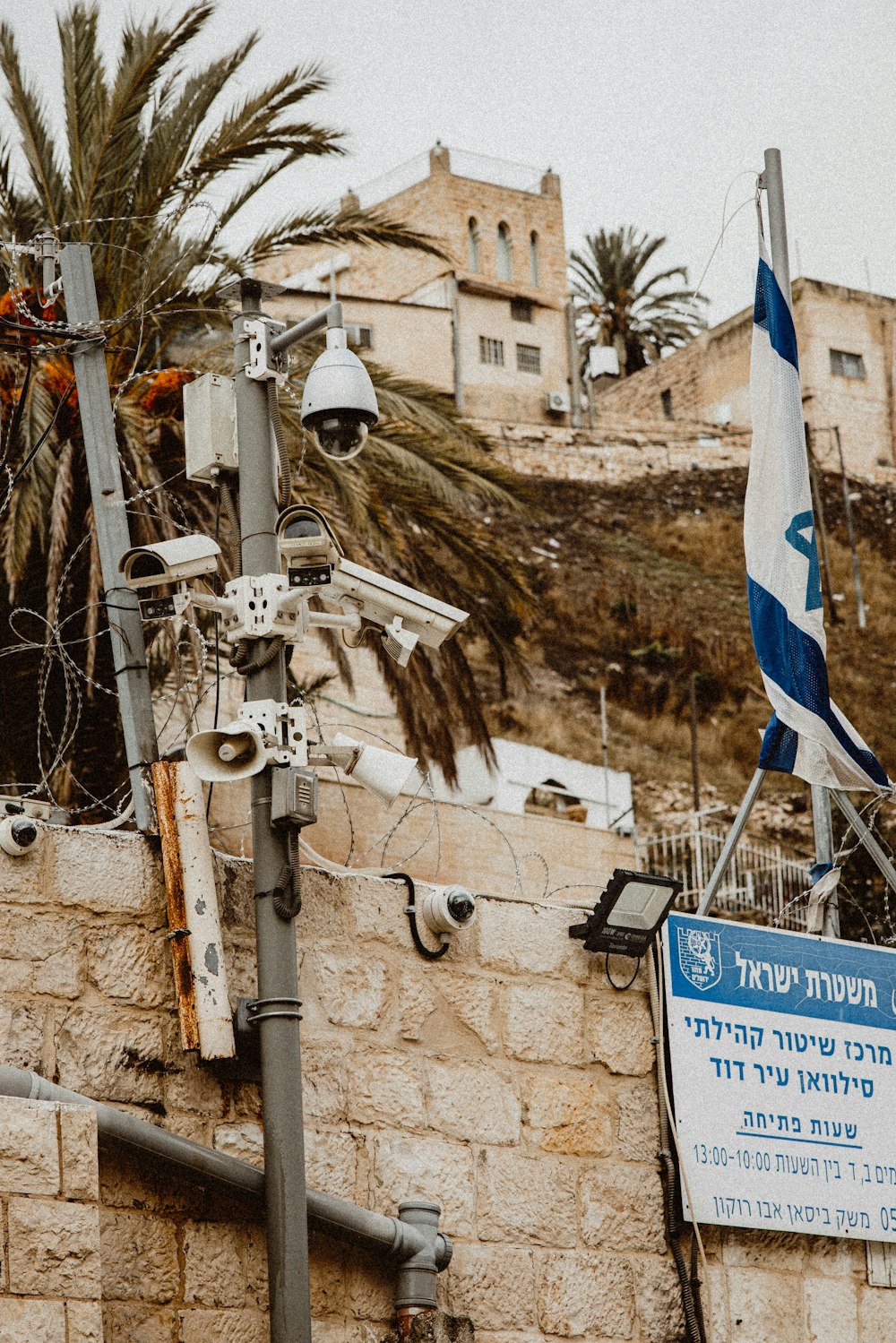 an israeli flag is hanging on a building