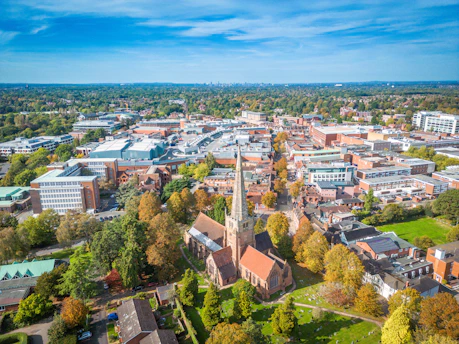 an aerial view of a city with trees and buildings