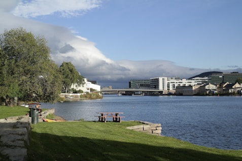 a view of a body of water with buildings in the background