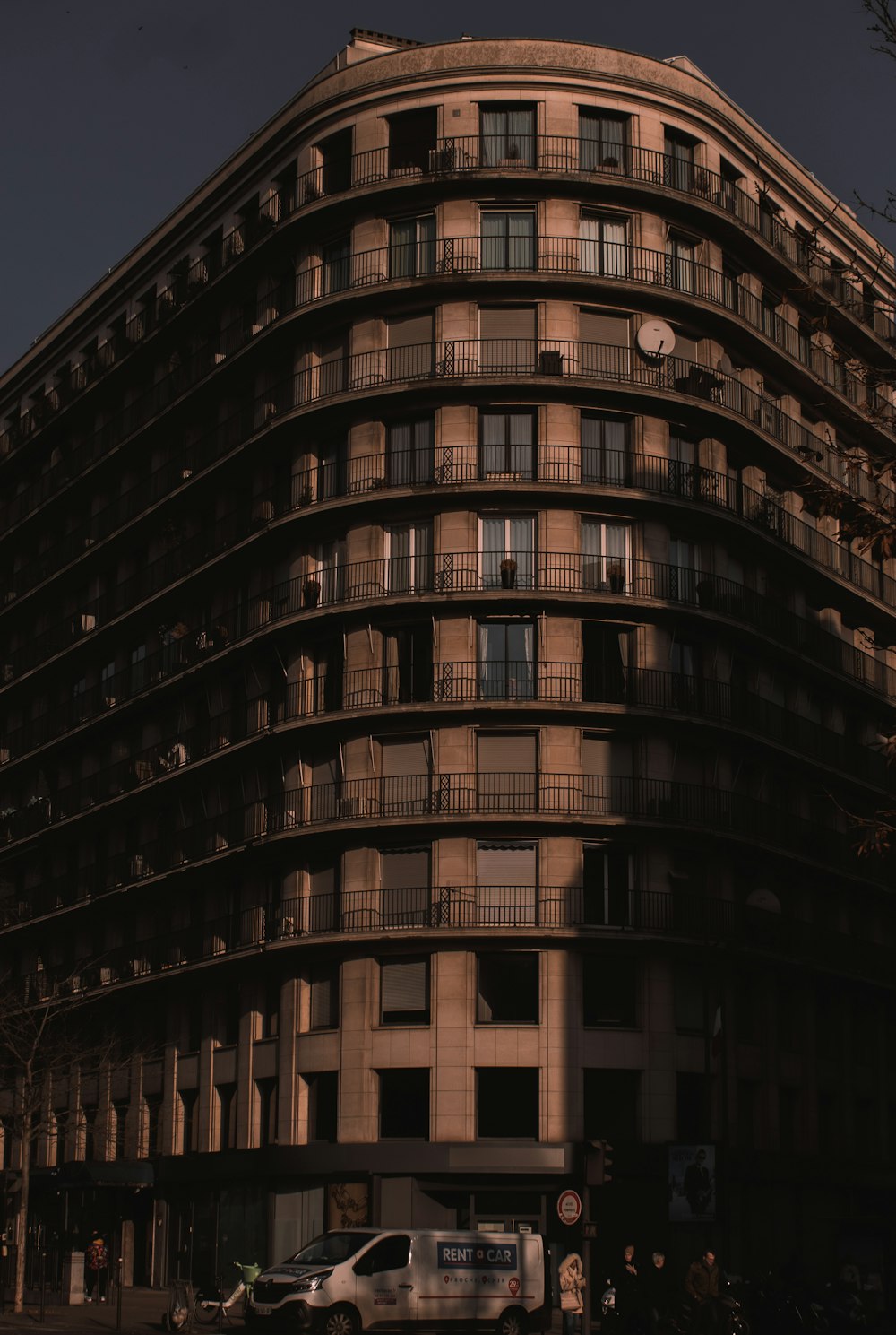 a tall building with balconies and balconies on the top of it