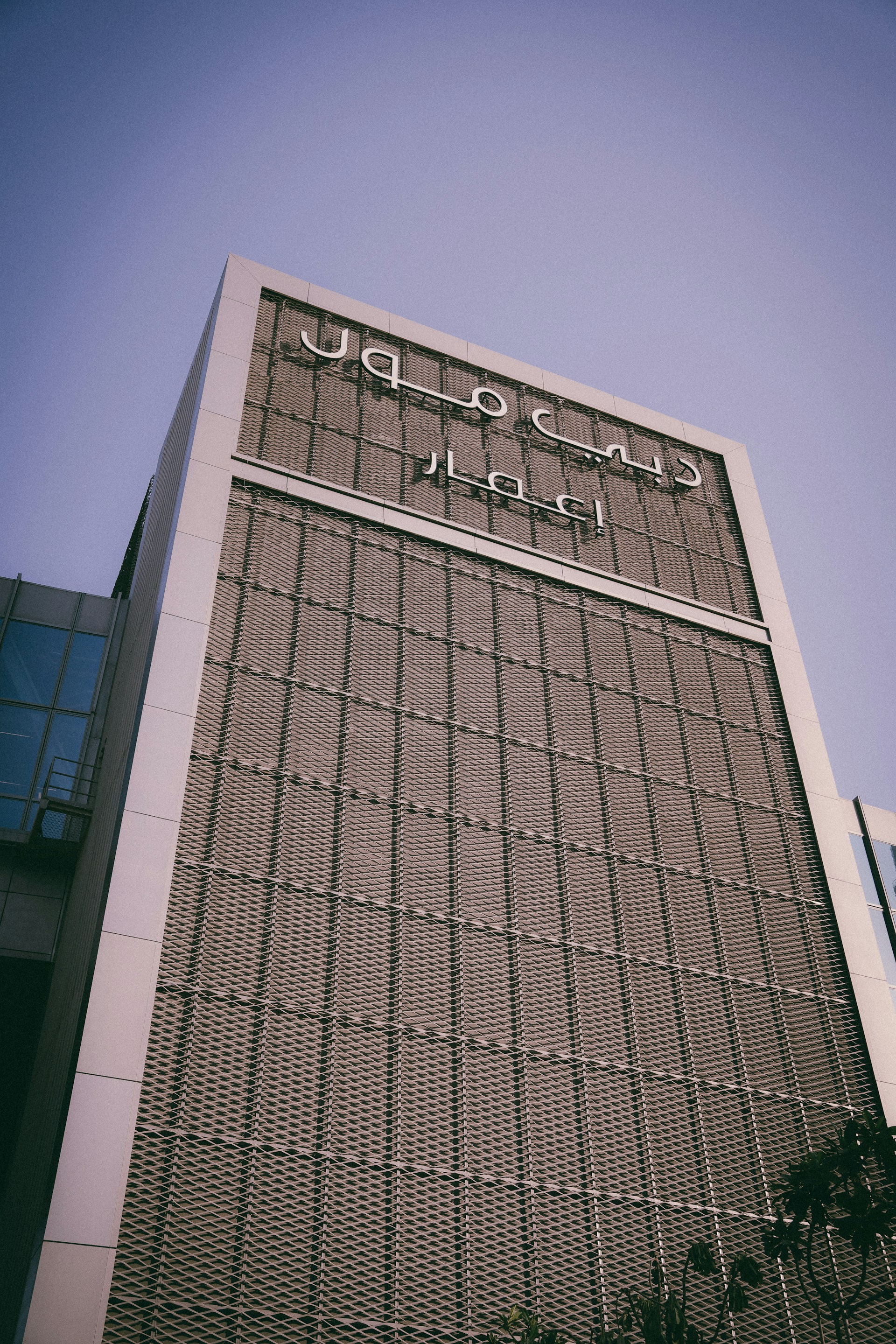 woman wearing yellow long-sleeved dress under white clouds and blue sky during daytime
