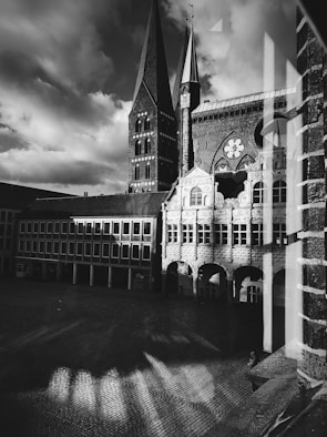 A black and white photograph of a historic city square.