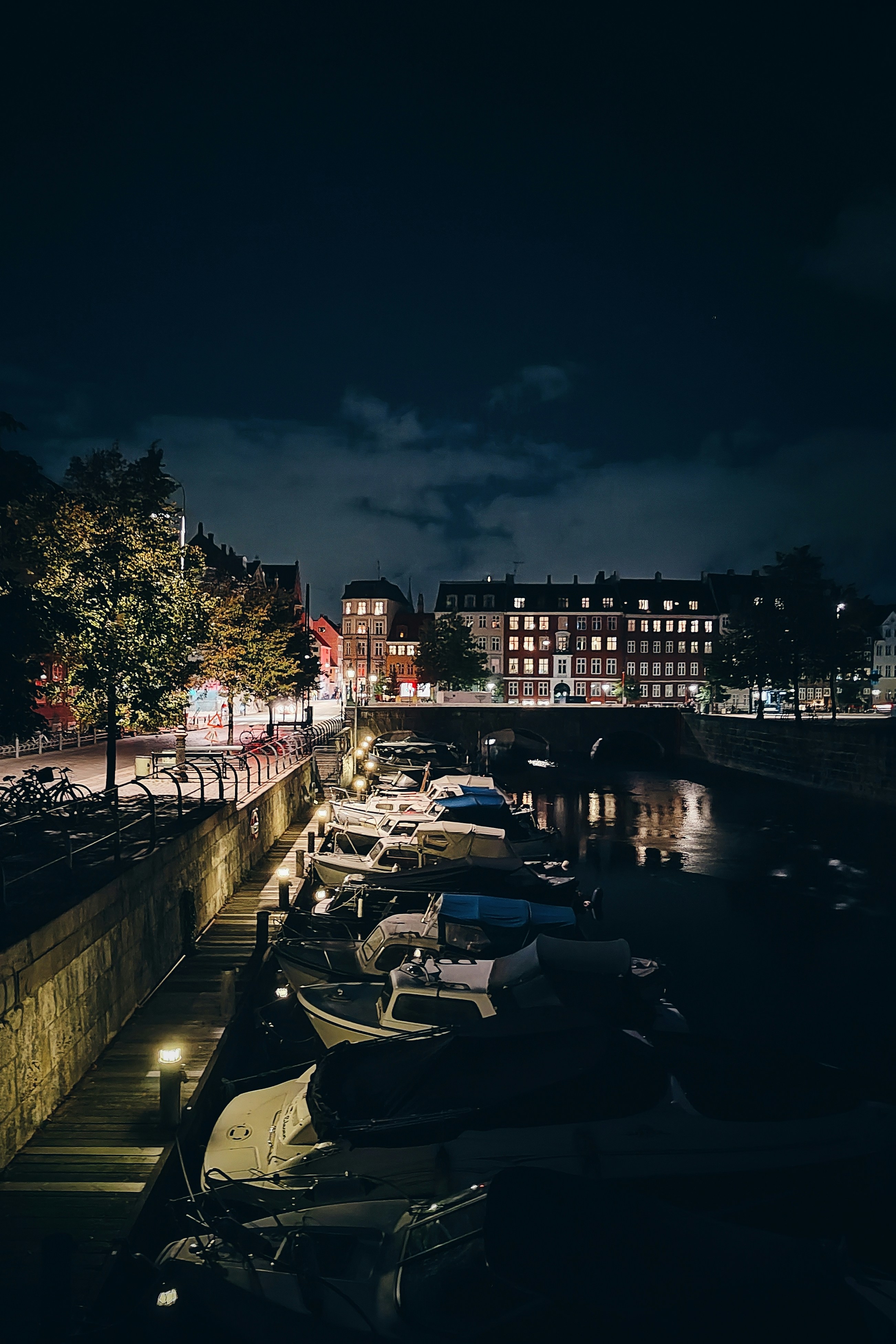 a harbor filled with lots of boats at night