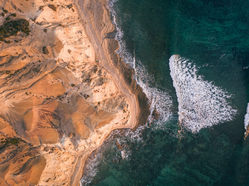 an aerial view of a beach and ocean