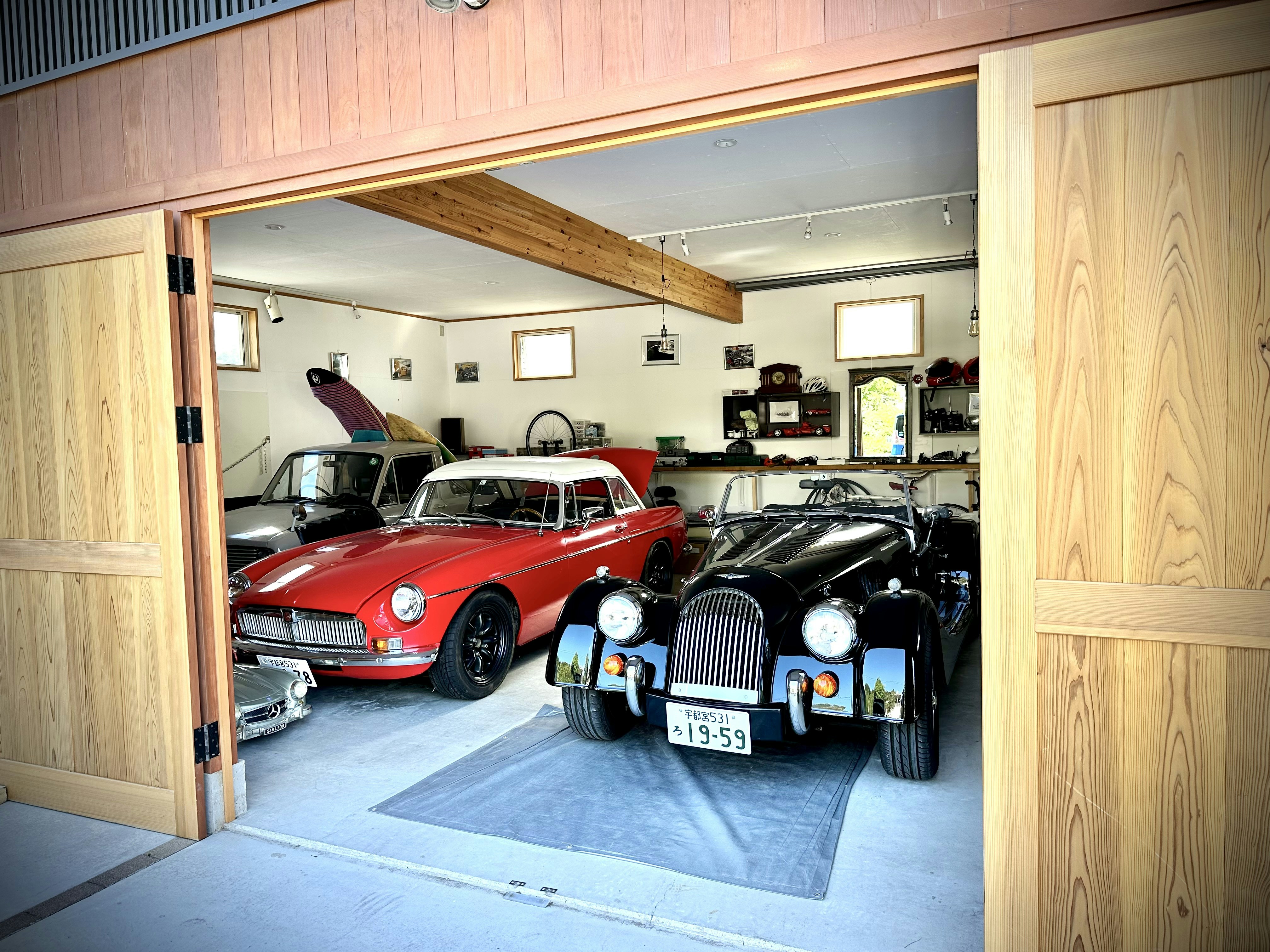 A spacious garage interior featuring an open garage door.