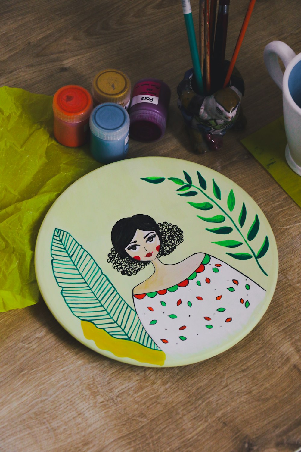 a picture of a woman painted on a plate