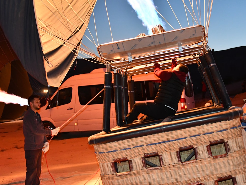 a man is on a hot air balloon