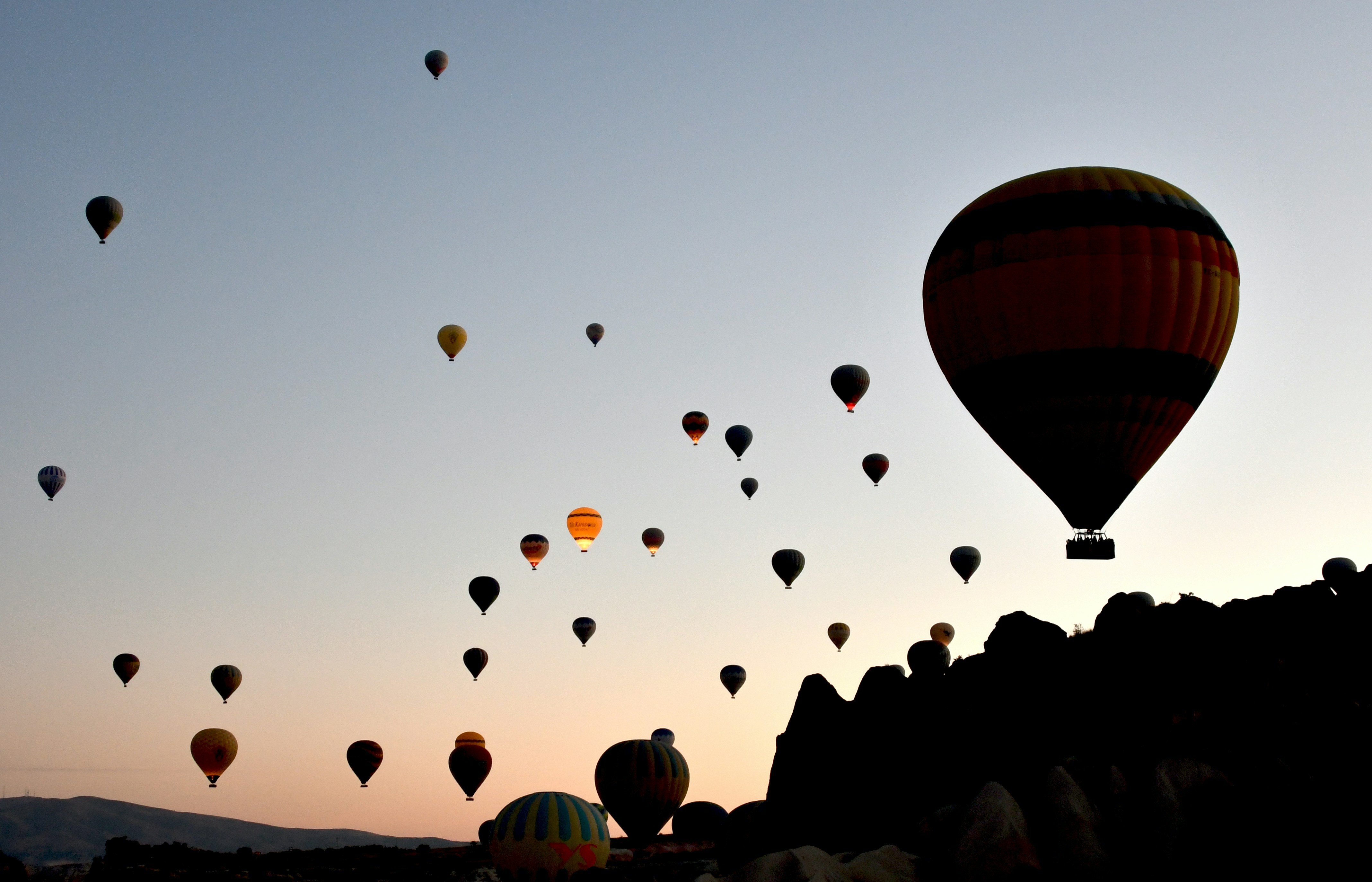 A group of hot air balloons flying in the sky photo – Free Airplane ...