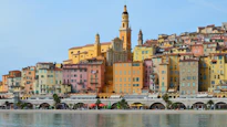 a group of buildings that are next to a body of water