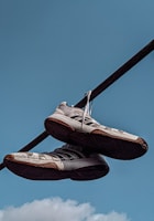 A pair of sparkling clean sneakers drying on a rack in Loundry Jaya