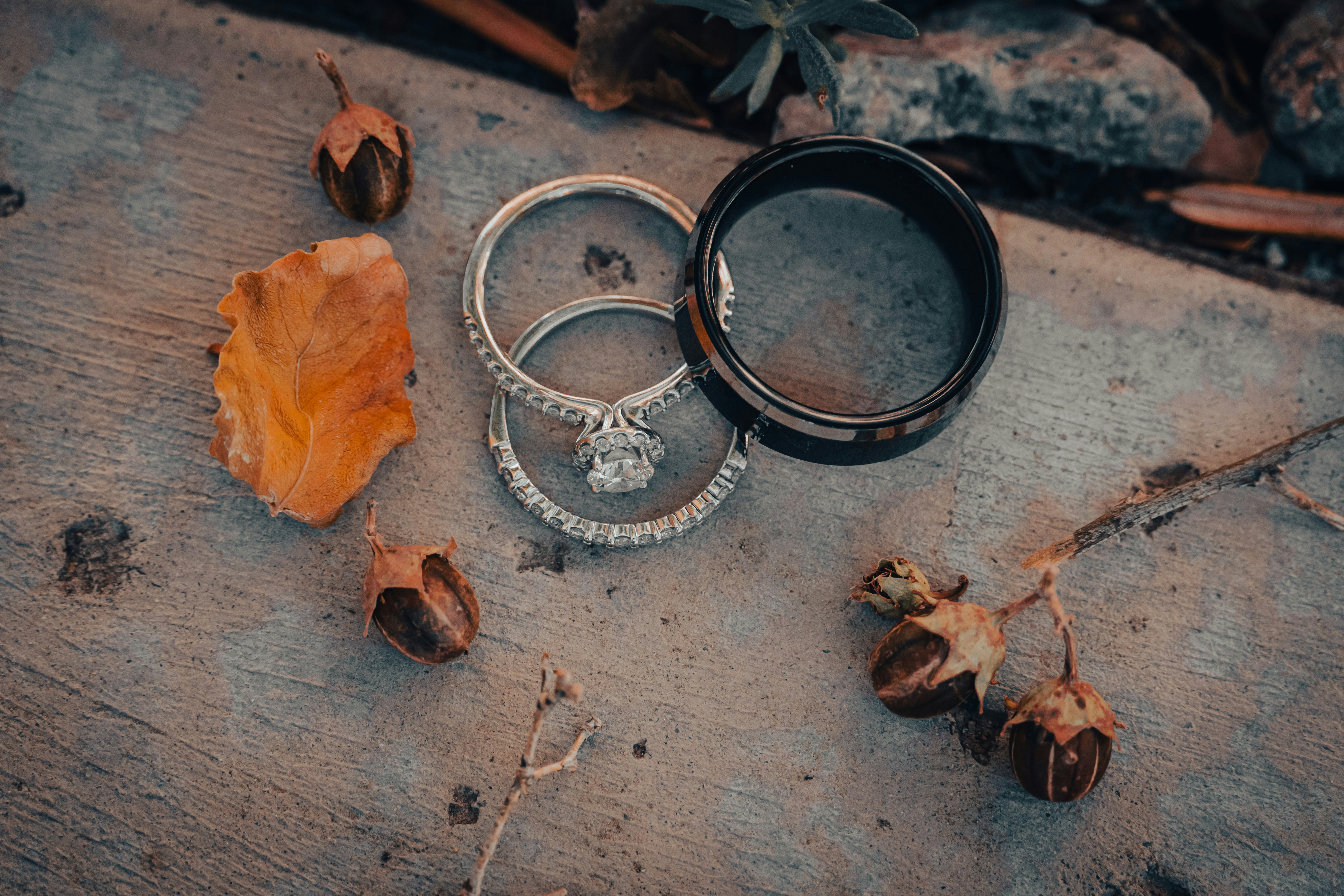 a couple of rings sitting on top of a wooden table