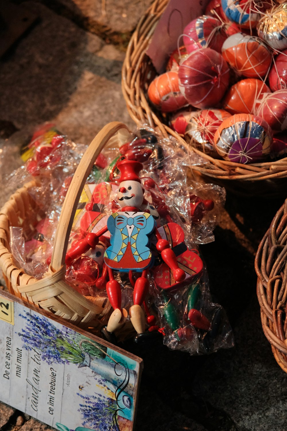 a basket filled with lots of candy next to other baskets