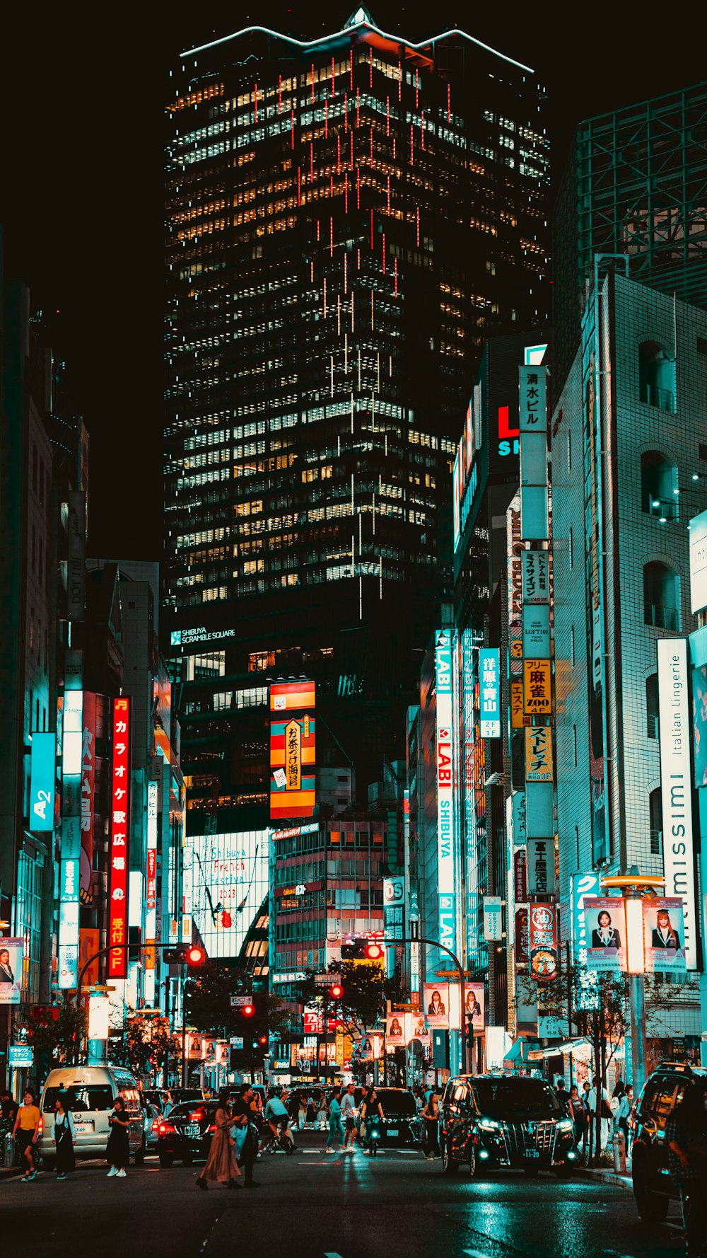 a city street filled with lots of tall buildings