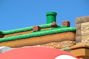 Screenshot of a colorful Roblox game level with custom scripting elements visible