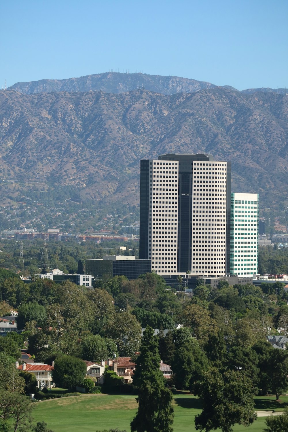 a city with mountains in the background