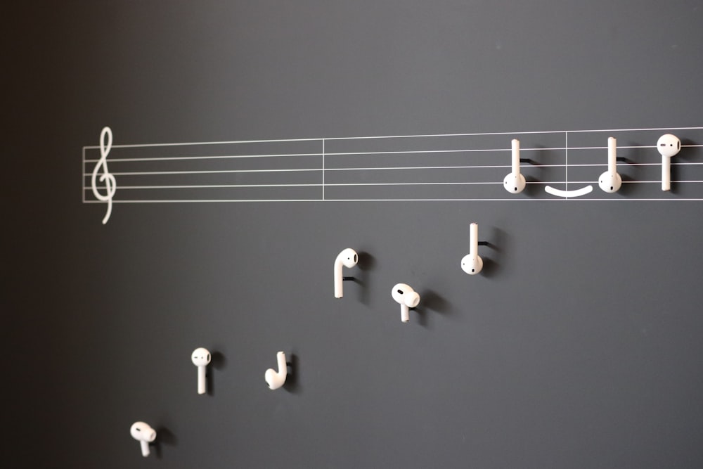 a wall with musical notes and earphones on it