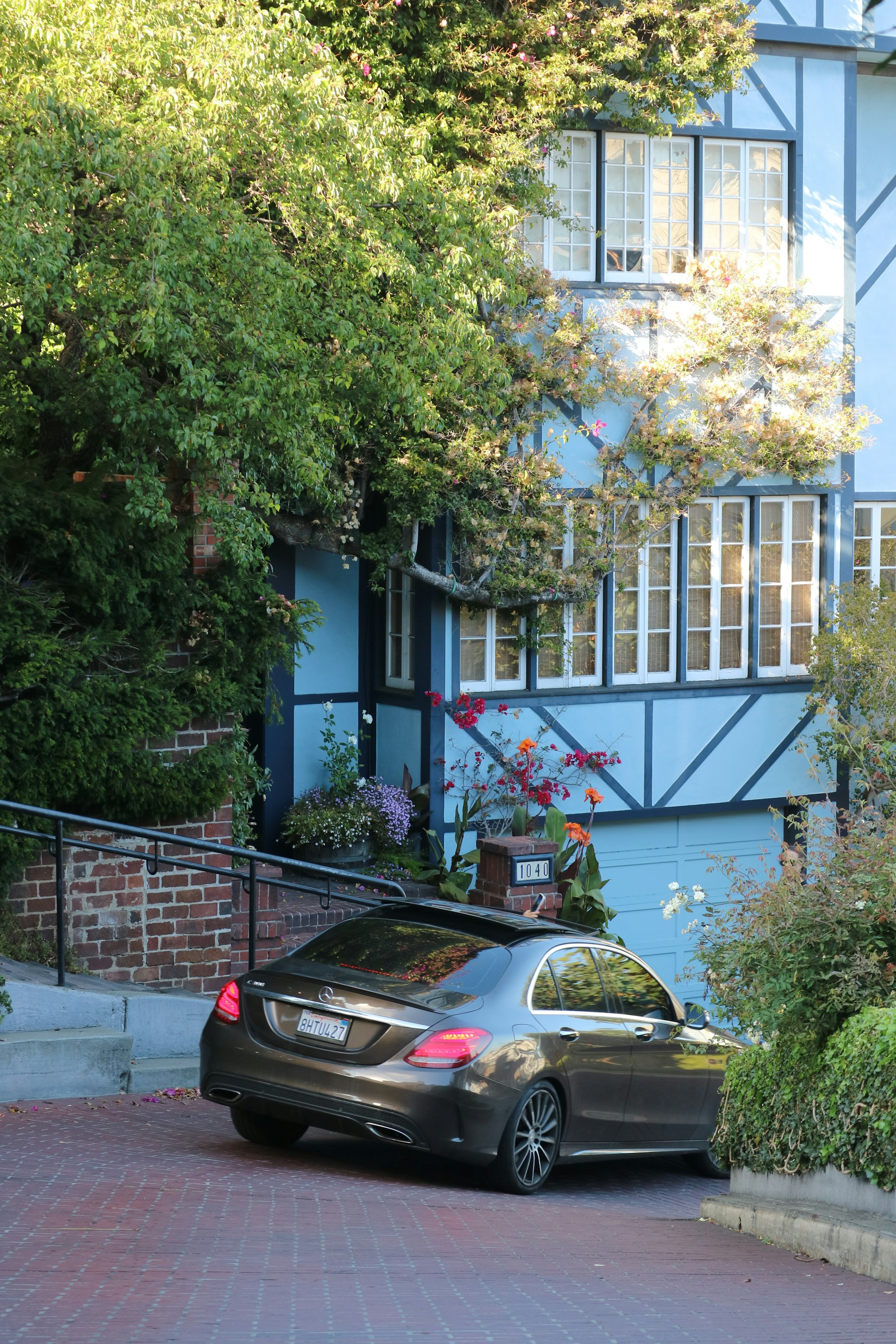 black and brown leather padded tub sofa