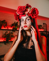 a woman with makeup and flowers on her head