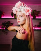 A colorful floral chest piece glowing under studio lighting against dark skin.