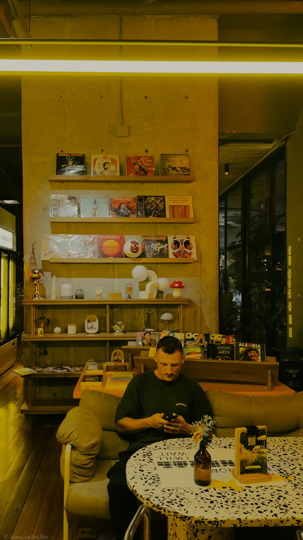 a man sitting on a couch in a living room