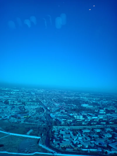 A vibrant aerial view of Dholera's expanding infrastructure under a clear blue sky.