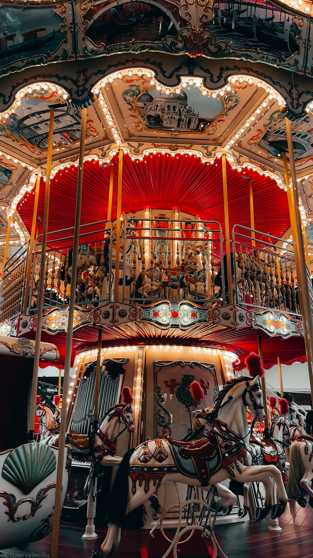 a merry go round with a horse and carriage