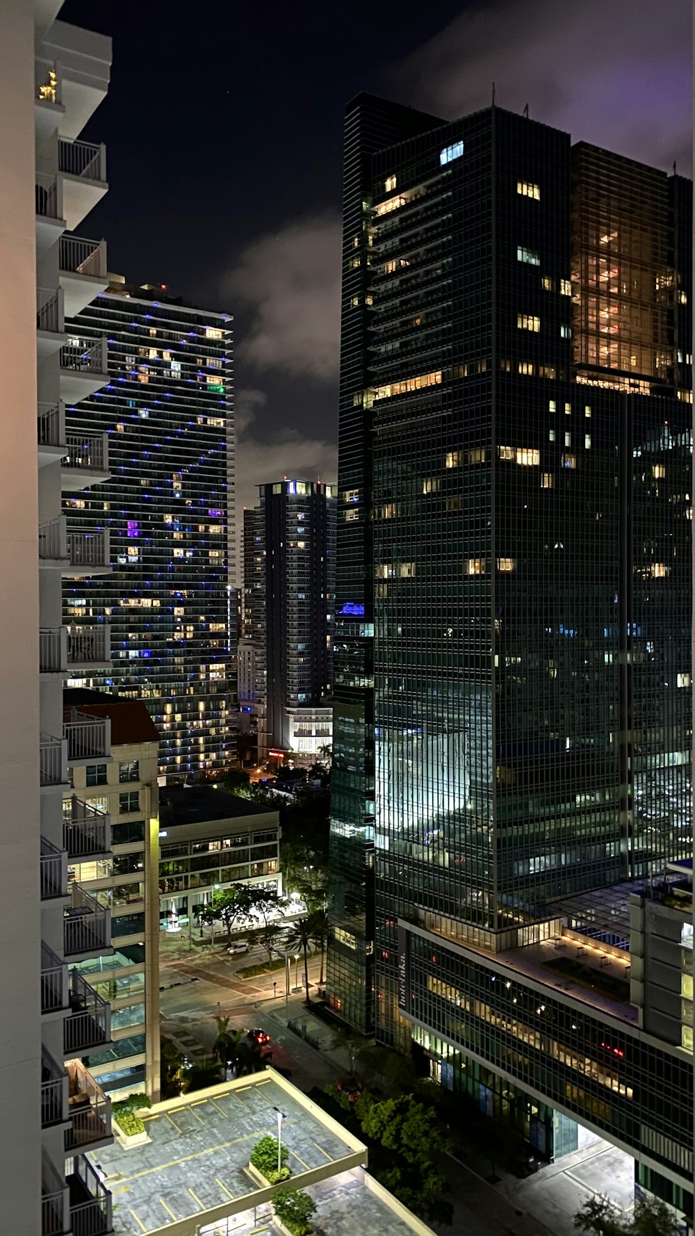 a view of a city at night from a high rise building