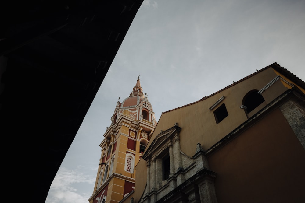 a tall tower with a clock on the top of it