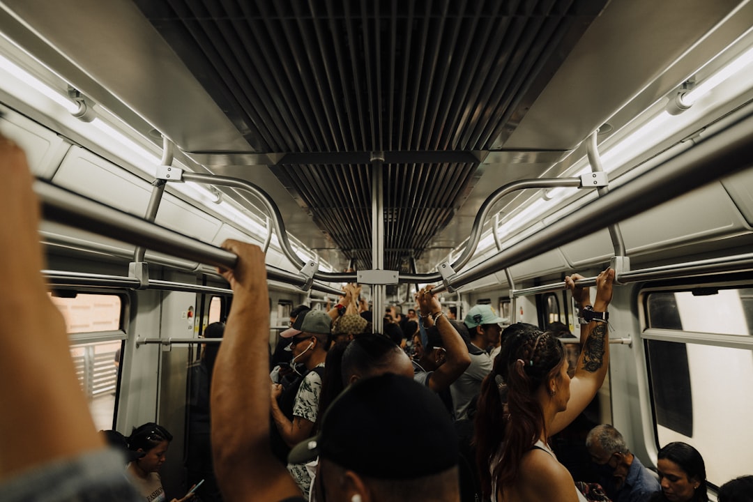 a group of people riding on a subway train