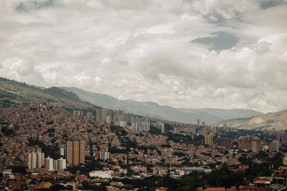 a view of a city with mountains in the background