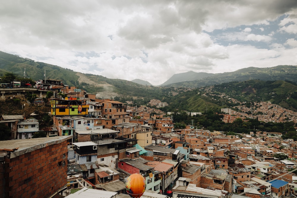 a view of a city with mountains in the background