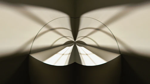 An abstract interplay of shadows and light creating a mysterious architectural silhouette.