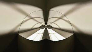 An abstract pattern of light and shadow creating depth.