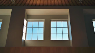 Bright room featuring aluminum window frames and glass panels.