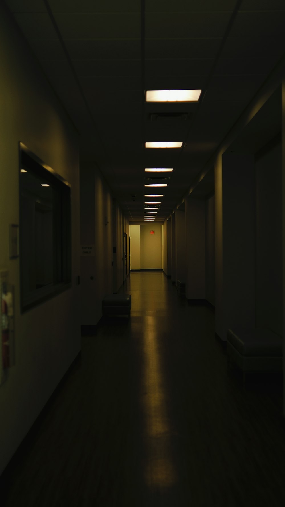 a dimly lit hallway in a building