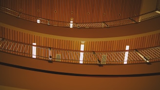 A completed railing system glowing under warm lighting in a home’s interior.