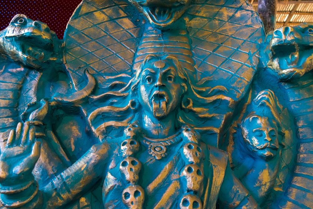 a close up of a statue of a god